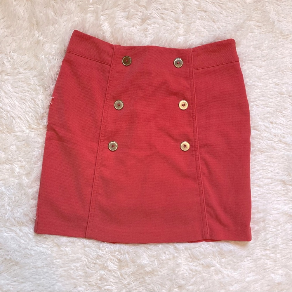 Lizzie Driver salmon pink golf skirt with spandex shorts